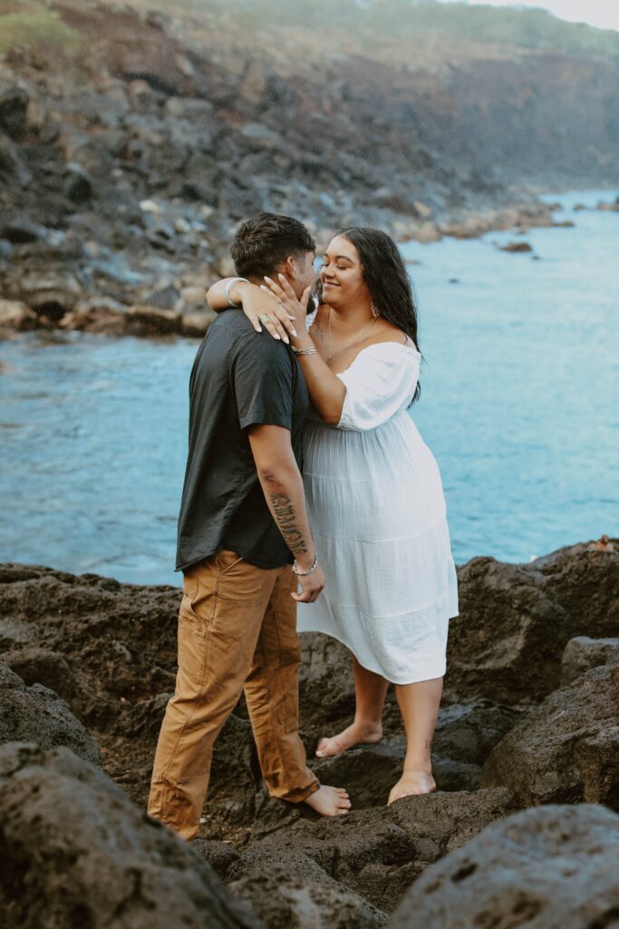 couple kissing on lava rock in hawaii elope san diego