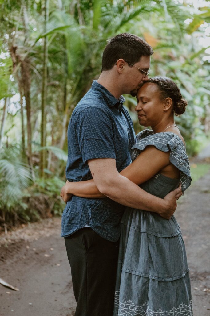 couple hugging under banana trees hawaii elopement photographer