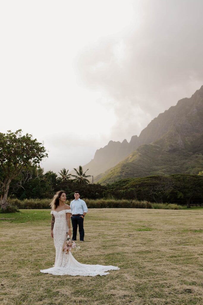 adventure elopement photographer couple in front of mountains in hawaii